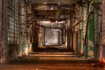 Fototapeta na wymiar Dilapidated workshop of the abandoned factory 