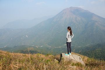Woman standing at the peak