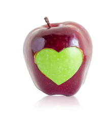 Green apple heart shape in red apple.