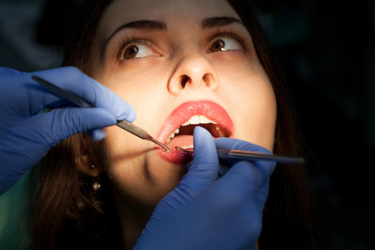  Young girl having dental check up