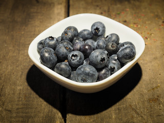 Fresh blueberries on wood