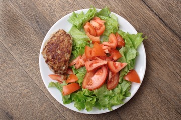 Fried cutlet meatballs with salad