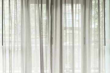 White see through window curtain in a home