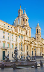 Fototapeta na wymiar Rome - Piazza Navona and baroque Santa Agnese in Agone church in morning light and Fontana del Moro.