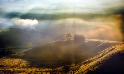 mountain landscape with  morning fog at sunrise