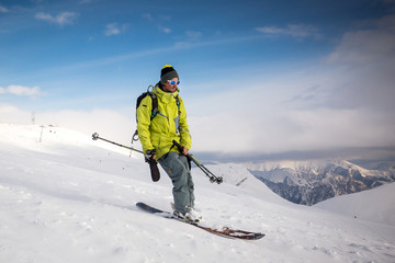 Fototapeta na wymiar Man snowboarding on snow in the mountains