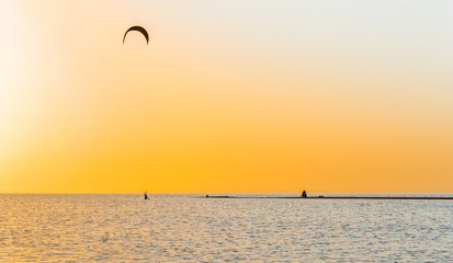 Picturesque sunset over the sand spit in the sea