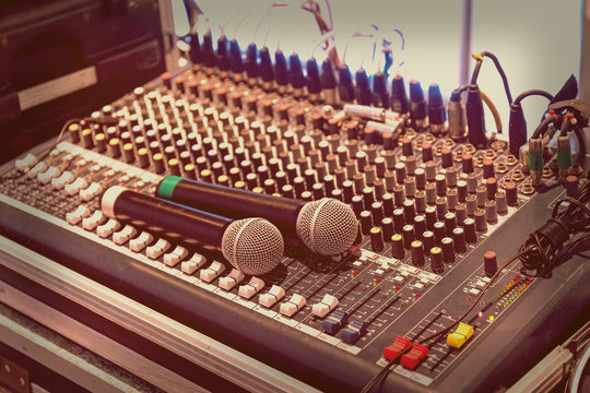 Two wireless microphone on sound mixer  panel
