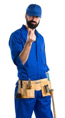 Plumber doing a money gesture