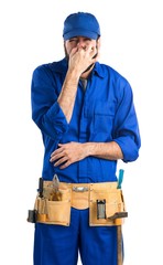 Plumber making smelling bad gesture