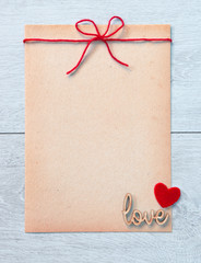 Greeting card mock up  for Valentine's day on wooden background. View from above