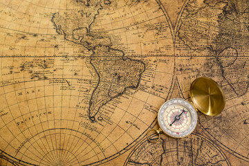 old compass  on vintage map