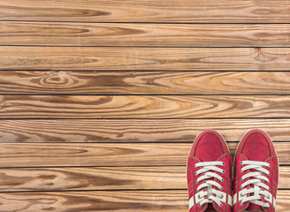 colorful shoes set on wooden background with copy space. Top view.