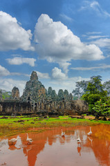Ancient Khmer architecture. Ta Prohm temple with giant banyan tree at sunset. Angkor Wat complex, Siem Reap, Cambodia travel destinations