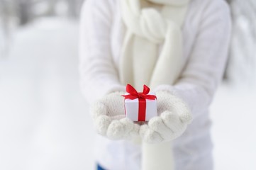 Closeup woman holding a gift.