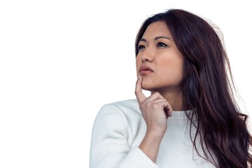 Fototapeta premium Thoughtful Asian woman with finger on chin