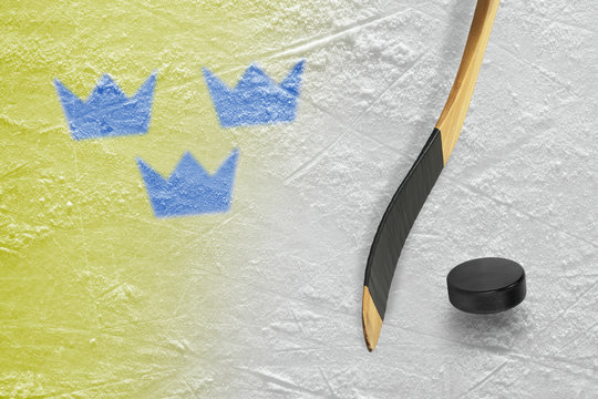 Hockey puck, stick and three crowns