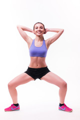 Young woman doing fitness exercise on white isolated background.