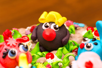 Obraz na płótnie Canvas Celebration colorful cake decorated with fruit, chocolate and fi