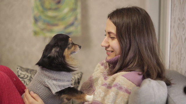 Mistress speaks with her little dog