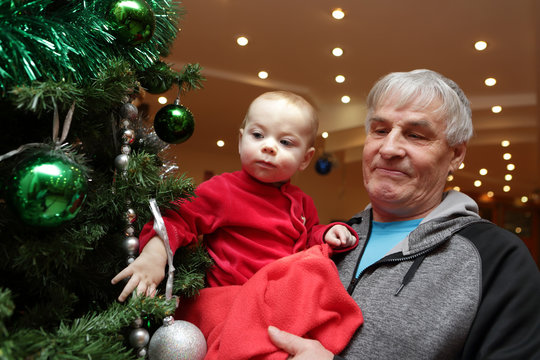 Baby Looking At Christmas Tree