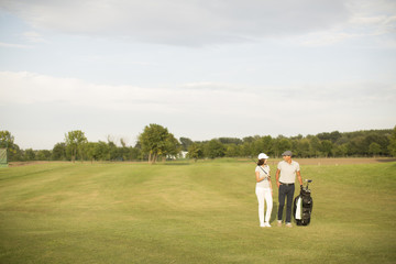 Young couple at golf court