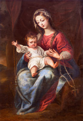 GRANADA, SPAIN - MAY 31, 2015: The Madonna (The Virgin of the Rosary) painting in church Monasterio de la Cartuja by unknown artist of 18. cent. - obrazy, fototapety, plakaty