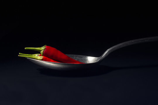 Chili (Capsicum) on a tablespoon