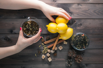 Woman hold in hands glass cup tea
