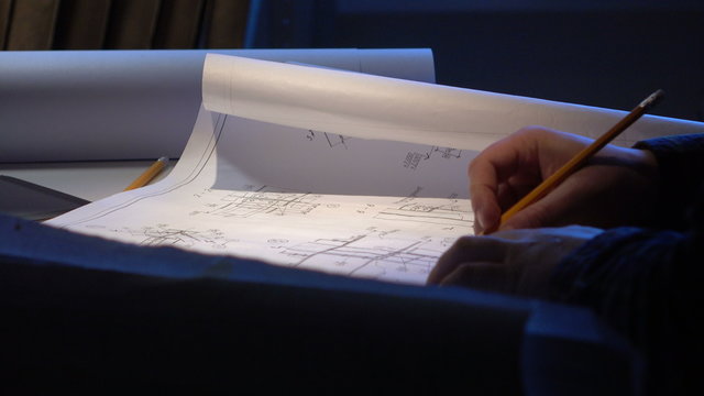 Engineer checks the construction drawings