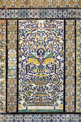 Tunisia. Kairouan - the Zaouia of Sidi Saheb. Fragment of ceramic tiled panel with floral and architectural motifs