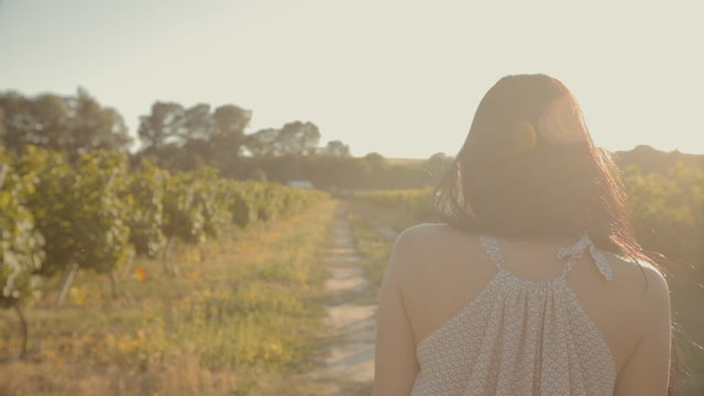 Happy young woman in the vineyards