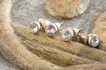 Beautiful shiny earrings on the vintage background