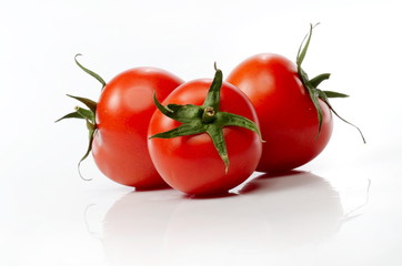 fresh tomatoes isolated on white background