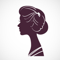 Women silhouette head with beautiful stylized hairstyle © prezent