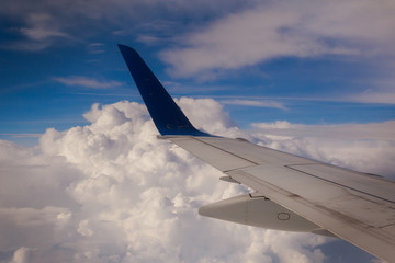 airplane wing sky clouds