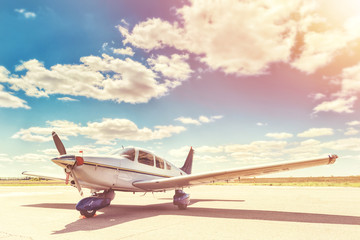Fototapeta na wymiar Propeller plane parking at the airport.