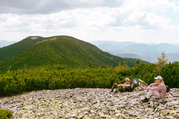 Tourists relax after a hike in the Ukrainian Carpathians