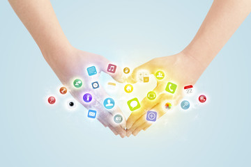 Hands creating a form with mobile app icons