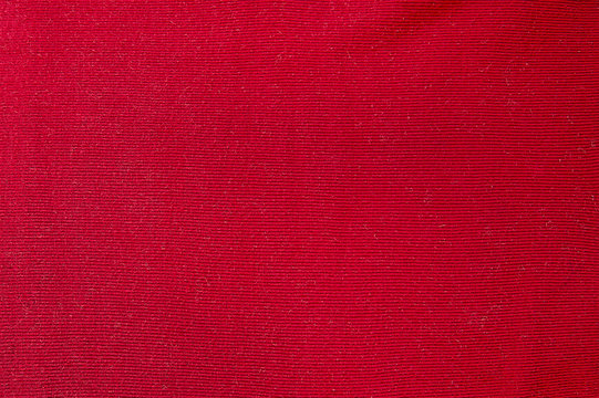 Red woolen sweater background texture