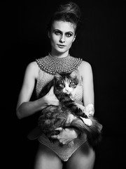Woman portrait wearing lingerie and holding cute kitten monochrome