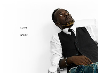 Handsome african businessman sitting - aspire and inspire