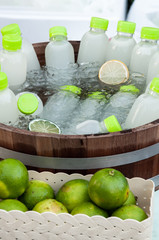 Lemon juice bottle, in a wooden barrel