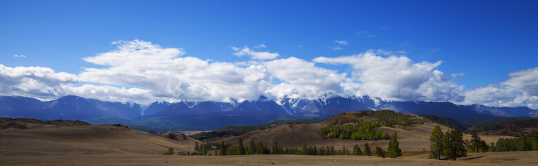 Snowy mountain peaks panorama
