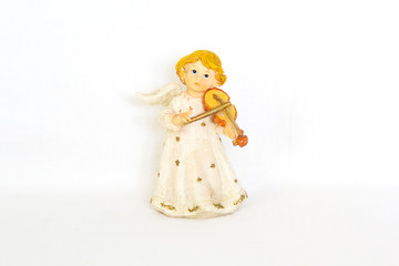 Figurine of angel on white background