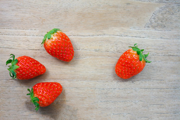 Fresh strawberries on wooden background