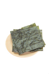 Nori , Japanese edible seaweed used as a wrap for sushi and onigiri