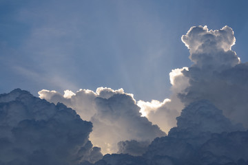 Blue sky with clouds and sun