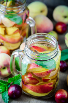 Jar delicious refreshing drink of peach fruits and plum  with mi