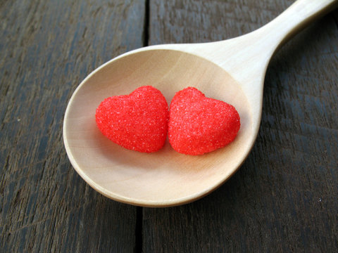 red heart on wooden spoon